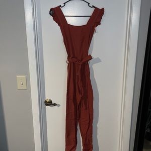 Rust colored jumper. Straight leg. Tie waist. US size small. Never worn w tags